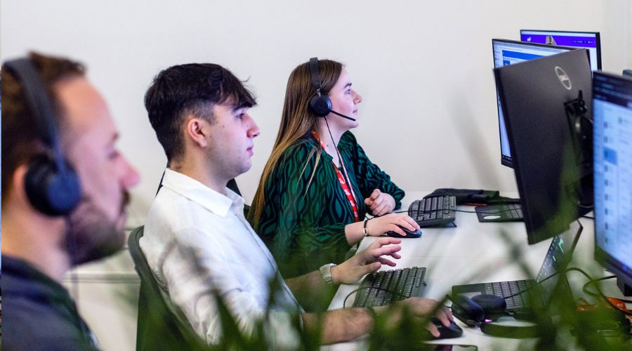 Workers learning how to choose a VoIP provider 