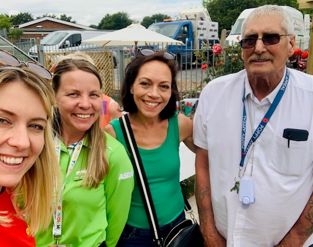 4 people smiling at the camera.